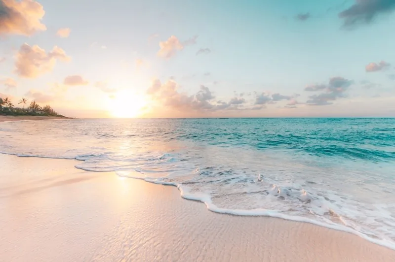 Minimal resort swim at golden hour on a pristine shoreline
